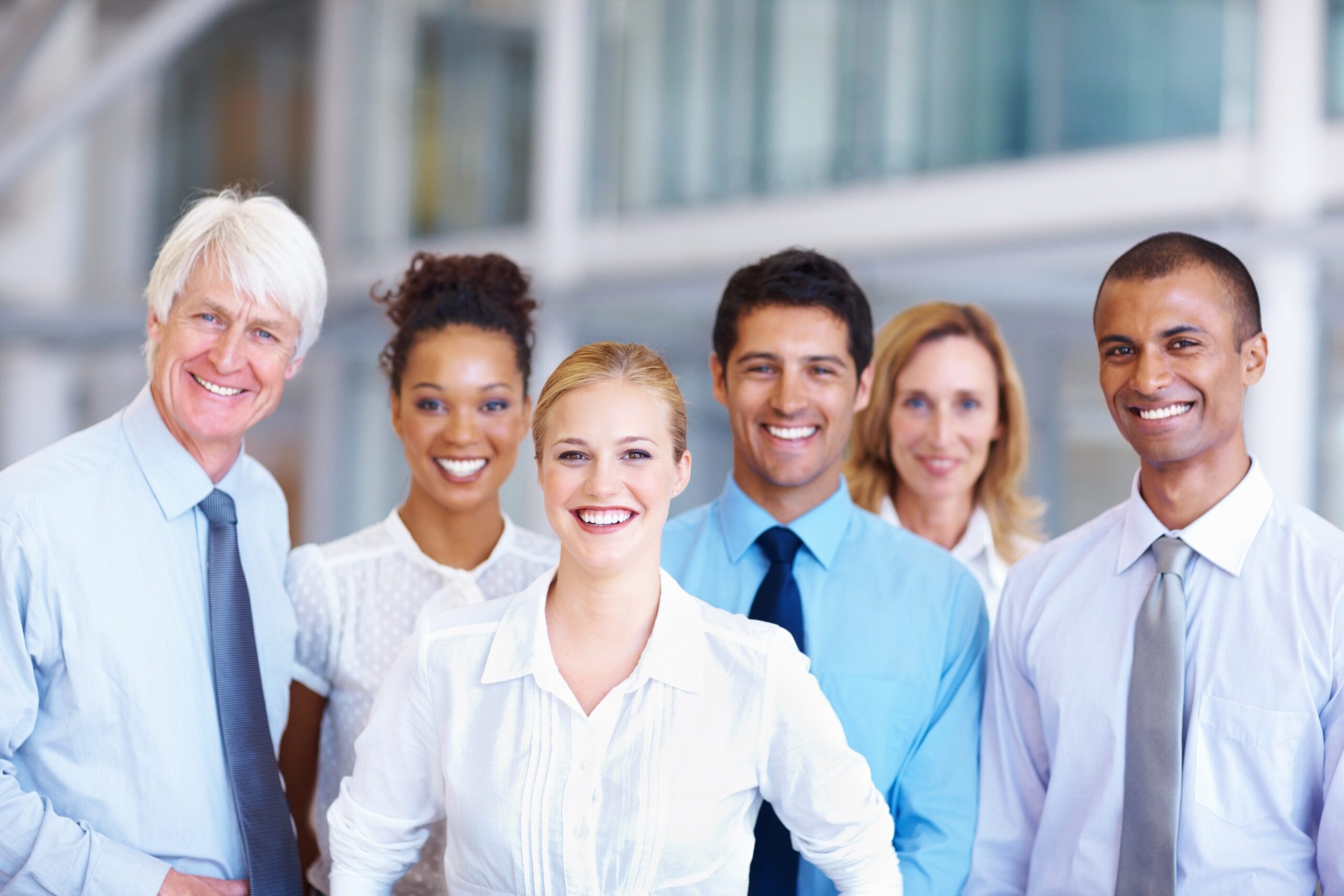 Business team. Portrait of multi racial business team smiling together at office. Business team. Portrait of multi racial business team smiling together at office