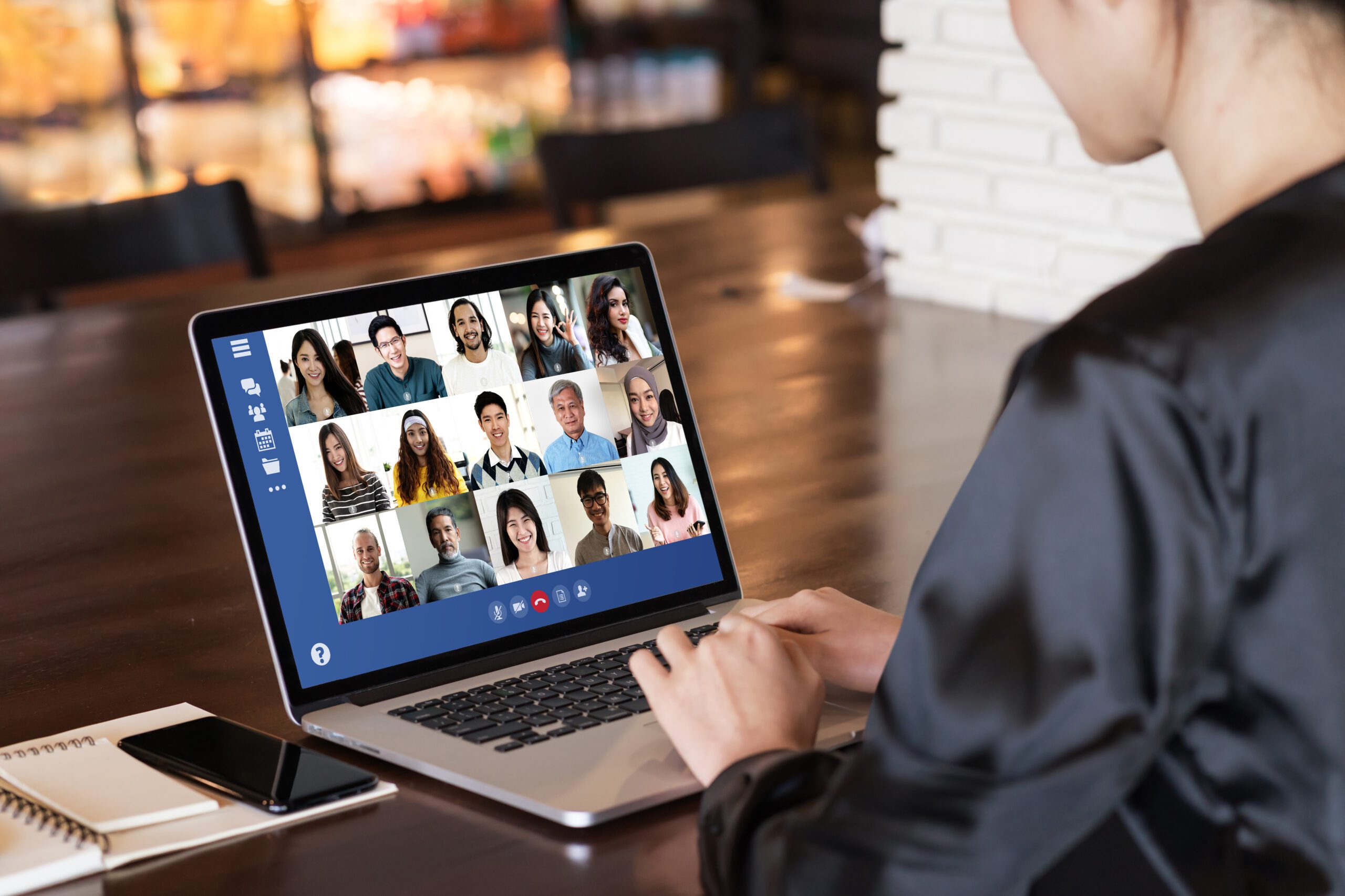 Back view of young asian business woman work remotely at home vi Back view of young asian business woman work remotely at home video conference remote call to corporate group. Meeting online,videocall, group discuss online concept with screen of teamwork on laptop.